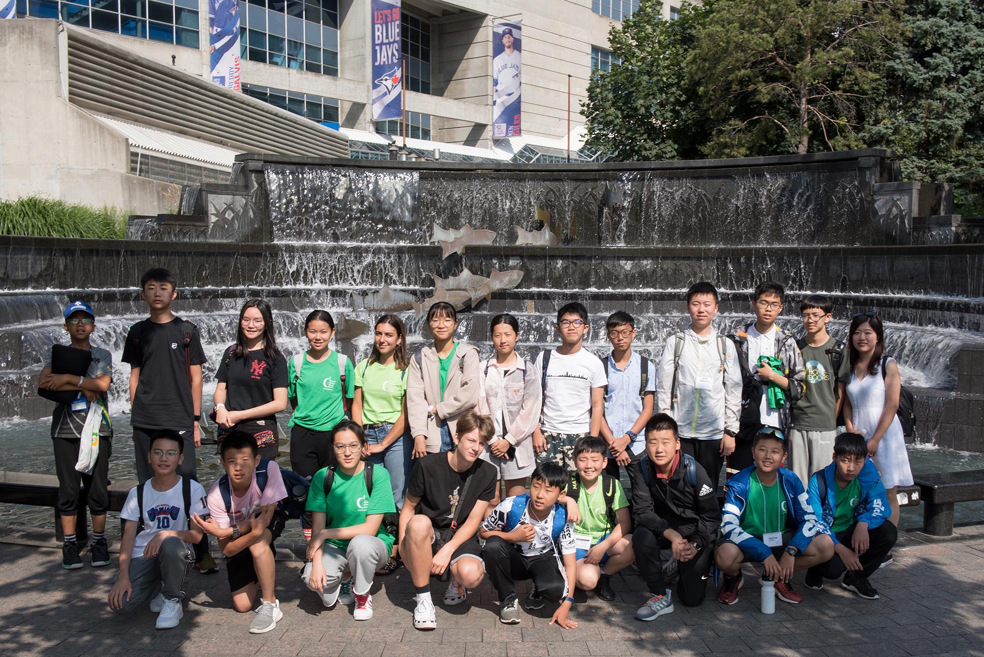 Group of students standing in front of fountain outside Open Gallery